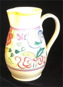 A Poole pottery jug with bird decoration
