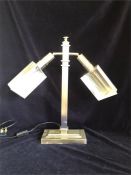 A Contemporary two arm chrome lamp.