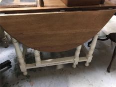 A Drop leaf table with white painted legs