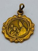 An 18ct yellow gold religious charm