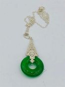 An unusual silver and jade pendant necklace with detachable mount