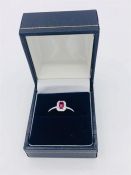 An 18ct white gold rectangular ruby and diamond cluster ring 50 points approx.