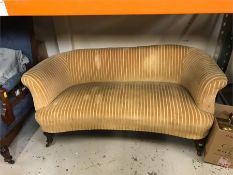 Two seater sofa on castors upholstered in mustard striped velvet AF