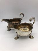 A pair of Georgian sauce or gravy boats on three feet in the form of scallop shells. 1757, London