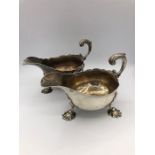 A pair of Georgian sauce or gravy boats on three feet in the form of scallop shells. 1757, London