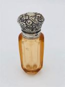 A Sterling Silver vinaigrette style perfume bottle with embossed decoration