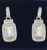 A pair of silver CZ and Opal set Art Deco style earrings