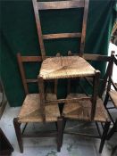 Four ladder back chairs with rush seats