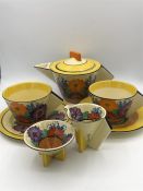 A Clarice Cliff Gay Day Bizarre tea for two set to include teapot, sugar bowl and milk jug along