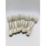 A set of twelve table forks, dated 1742, makers mark HB possibly Henry Bailey. (681g)