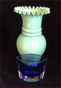 An Opalescent glass vase in green with a blue incased glass vase.