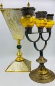 An Italian stand and a Persian three branch candlestick