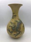 A Lladro vase with a Chinese Dragon theme