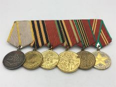 . Soviet Russian, world war two and postwar anniversary medals. Comprising:medal for combat service;