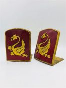 A pair of Antique foldable red and gold bookends with a Dragon motif.
