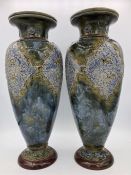 A pair of Royal Doulton stoneware vases, one AF signed to base