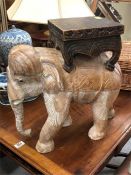 A wooden elephant plant stand or table