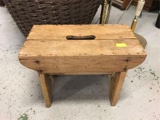 An Antique pine milking stool.