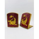 A pair of Antique foldable red and gold bookends with a Dragon motif.