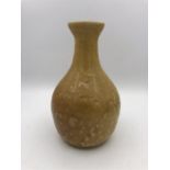 A Brown vase by Indian Artist Gulbanoo McGee, when based in Bombay.