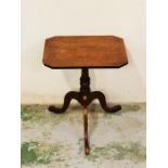 A Mahogany side table on pedestal legs