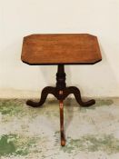 A Mahogany side table on pedestal legs