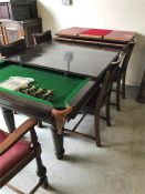 An Antique snooker/dining table with chairs red leather seat pads.