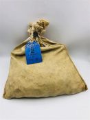 A £5 Bank Bag of Uncirculated 1/2 Penny coins in original 1967 Bank Bag