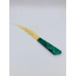 An ivory and jade green handled letter opener.
