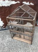 A wooden decorative bird cage