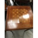 A small table with a chessboard design