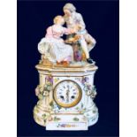 A Meissen mantle clock with some damage enamel clock face, featuring a courting couple.