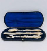 A Boxed Christening set of hallmarked silver knife, fork and spoon.