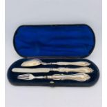 A Boxed Christening set of hallmarked silver knife, fork and spoon.