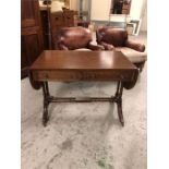 A drop leaf sofa table, Regency style with brass castors with two drawers.