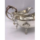 A pair of silver plated sauce boats