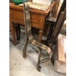 Two plain iron bench ends