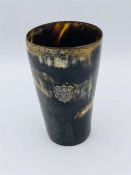 A Horn cup with glass bottom with an inscription on the cartouche dating it to 1885.