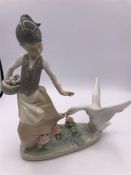 Lladro Figure of a Goose chasing Girl with Basket (22cm)