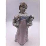 A Lladro figure 'Arms full of love', girl with two dogs (22cm)