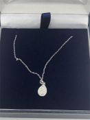 An 18ct white gold diamond pendant necklace 20pts