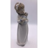 Nao figure of a girl with a doll (24cm)