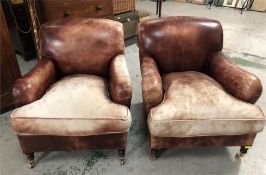 A Pair of George Smith Leather Club chairs on castors