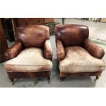 A Pair of George Smith Leather Club chairs on castors