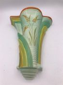 A Burliegh ware wall sconce, green grounds.