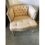 A French style Salon chair with reeded legs and button back detail.