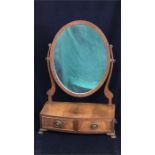 A Mahogany two drawer, oval toilet mirror.