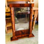 A Mahogany Mirror with turned pillar sides.