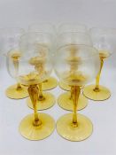 A set of eight amber stemmed glasses