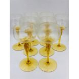 A set of eight amber stemmed glasses